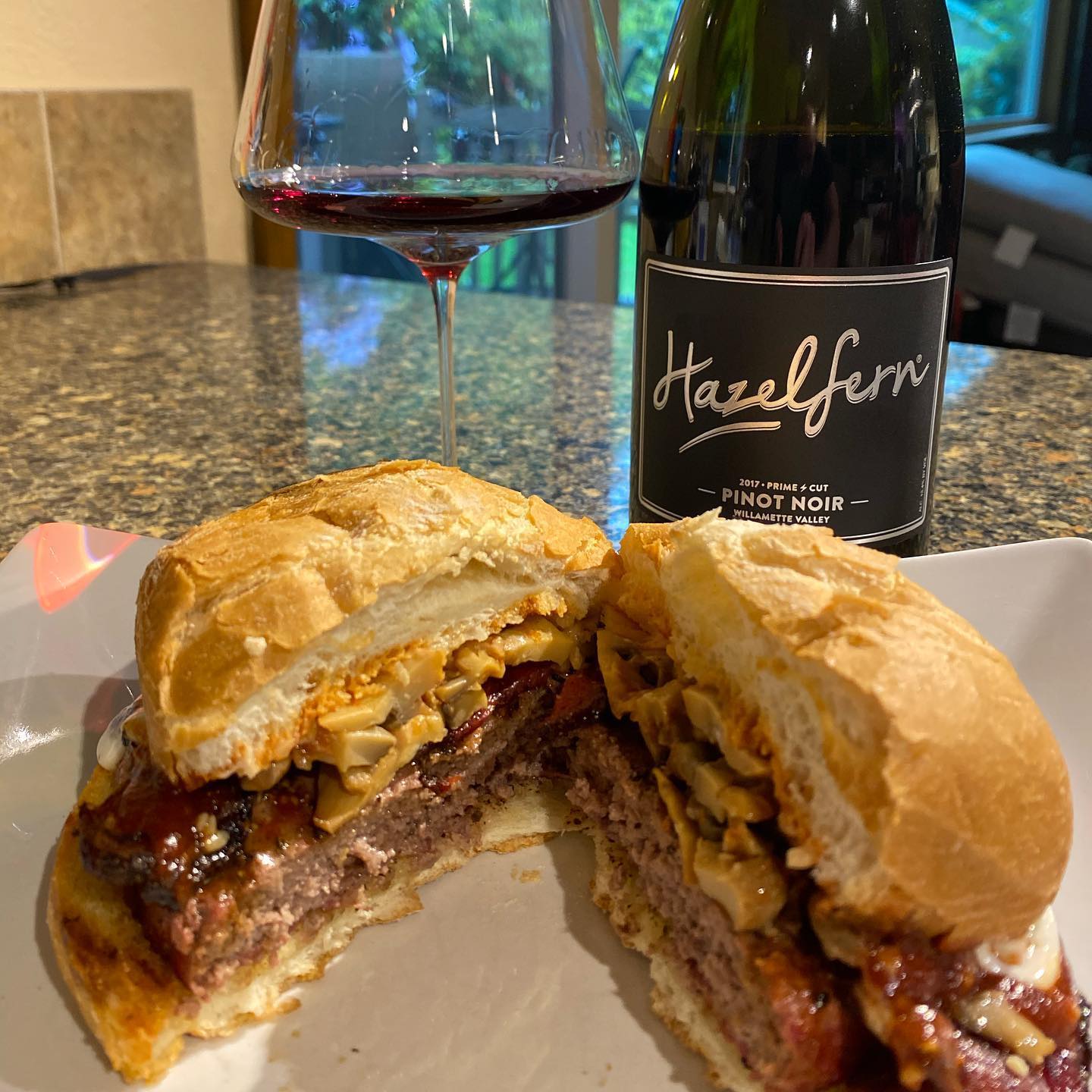 HazelFern’s Prime Cut Pinot with a burger topped with sautéed garlic mushrooms and baco…